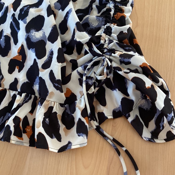 Cheeta print skirt, worn once. Blue, black, brown, and cream. Good condition. - Picture 3 of 10